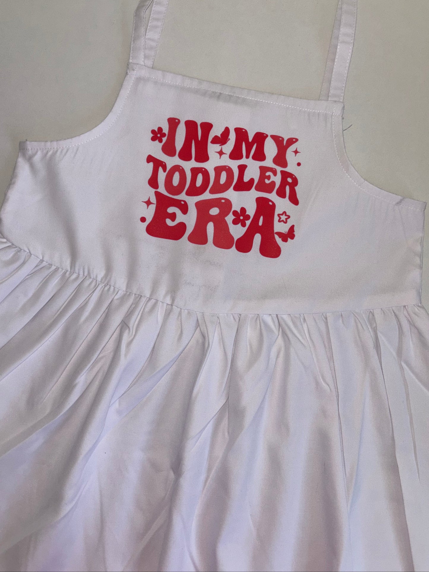 ‘In my toddler era’ white strappy dress