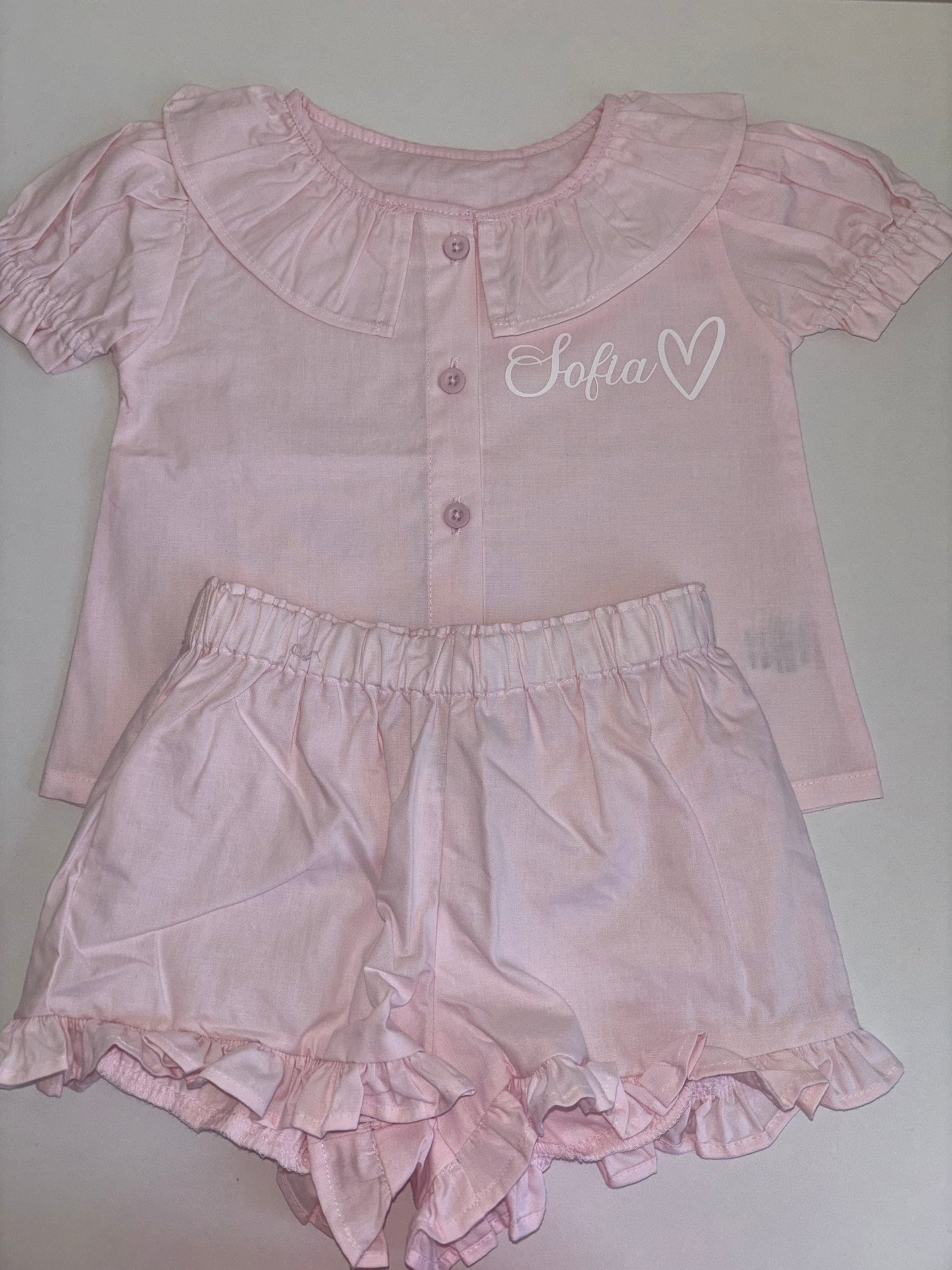 Pastel pink frilly shorts pyjamas